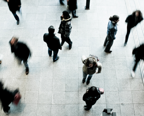 Featured image of people walking through a busy intersection